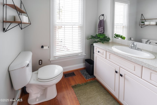 4409 Pinehurst Dr N, Wilson, NC 27896 - half bathroom with vanity and wood finished floors