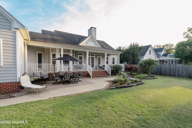 4409 Pinehurst Dr N, Wilson, NC 27896 - rear view of house with a chimney and a patio area