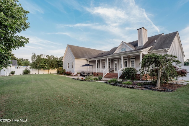 4409 Pinehurst Dr N, Wilson, NC 27896 - view of front of property featuring ceiling fan, a chimney, a porch, and a patio