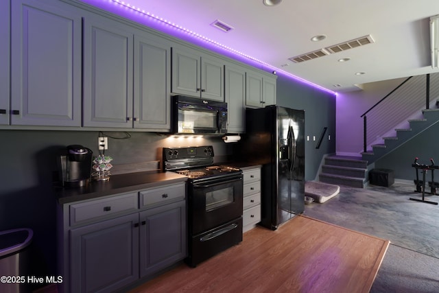4409 Pinehurst Dr N, Wilson, NC 27896 - kitchen featuring black appliances, dark countertops, and recessed lighting