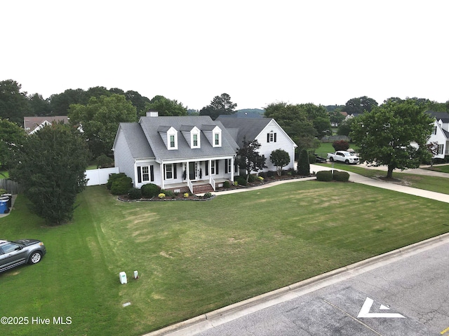 4409 Pinehurst Dr N, Wilson, NC 27896 - new england style home with covered porch and a shingled roof