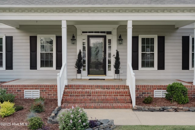 4409 Pinehurst Dr N, Wilson, NC 27896 - doorway to property featuring a porch and roof with shingles