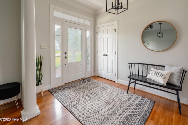 4409 Pinehurst Dr N, Wilson, NC 27896 - foyer entrance featuring crown molding, wood finished floors, and a chandelier