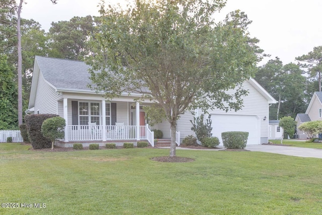1113 Palmer Way, Morehead City, NC 28557 - view of front of house featuring covered porch, concrete driveway, a front yard, a garage, and a shingled roof