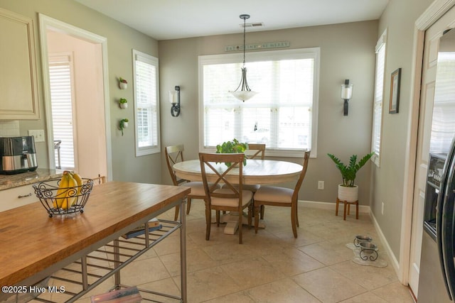 1113 Palmer Way, Morehead City, NC 28557 - dining space with healthy amount of natural light and light tile patterned flooring
