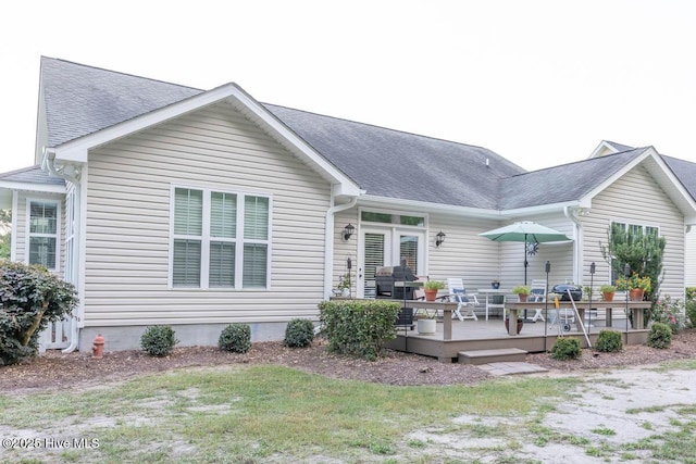 1113 Palmer Way, Morehead City, NC 28557 - back of house featuring a wooden deck, a shingled roof, a lawn, and french doors