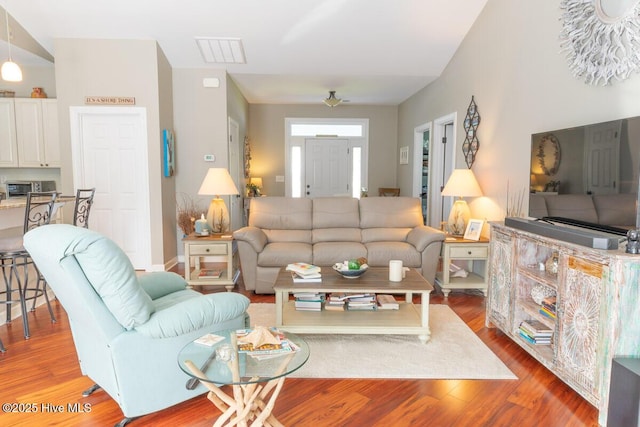 1113 Palmer Way, Morehead City, NC 28557 - living room featuring wood finished floors