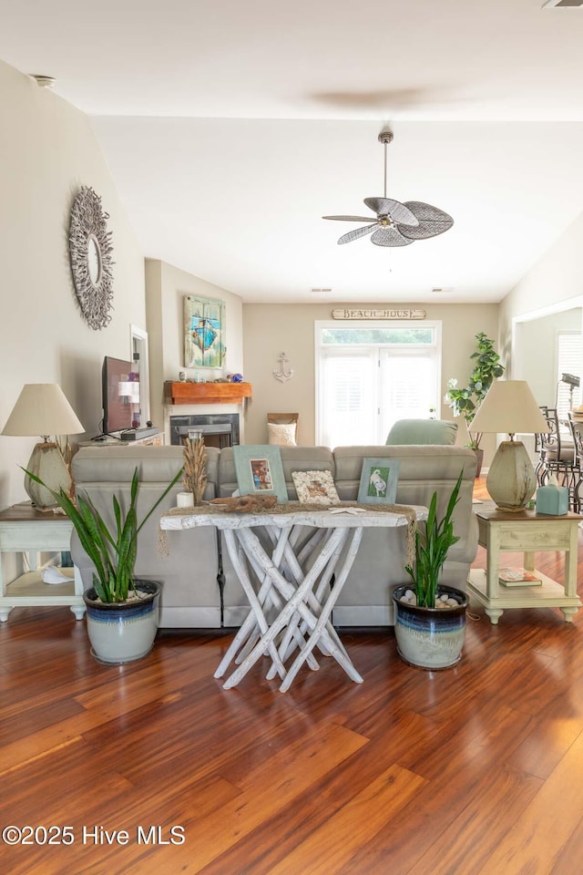 1113 Palmer Way, Morehead City, NC 28557 - living area featuring wood finished floors, ceiling fan, a fireplace, and lofted ceiling