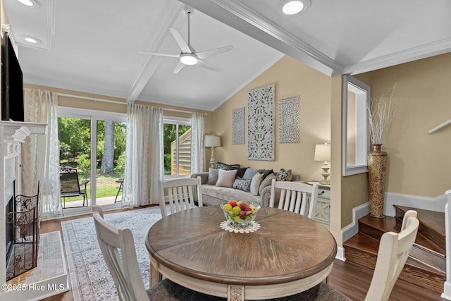 241 Saint James Ct, Wilmington, NC 28409 - dining space featuring wood finished floors, ceiling fan, a fireplace, and crown molding