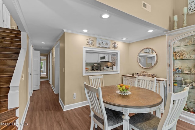 241 Saint James Ct, Wilmington, NC 28409 - dining room with stairs, wood finished floors, recessed lighting, and ornamental molding