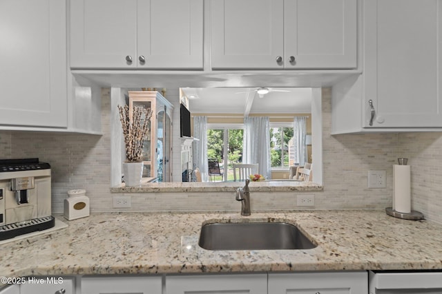 241 Saint James Ct, Wilmington, NC 28409 - kitchen featuring tasteful backsplash, white cabinets, a ceiling fan, and light stone countertops