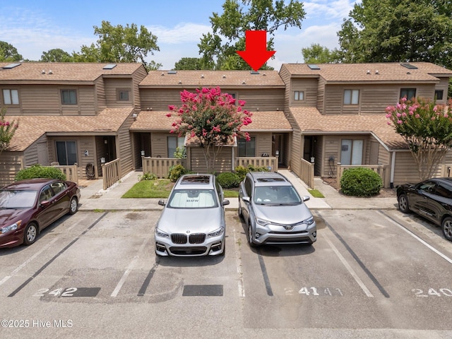 241 Saint James Ct, Wilmington, NC 28409 - view of front of home featuring uncovered parking and roof with shingles