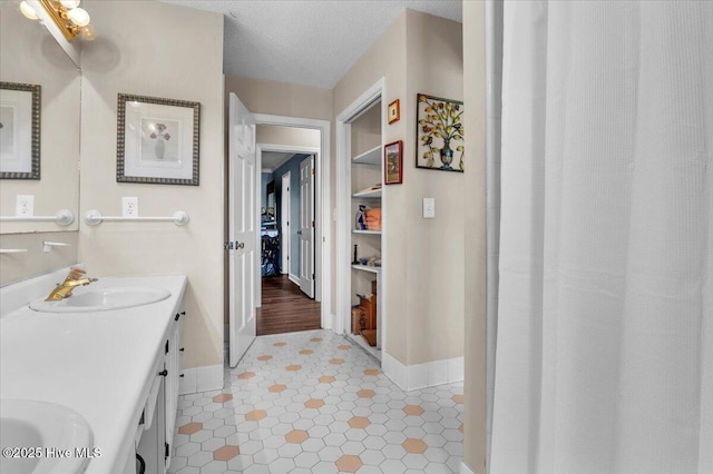 198 Verona Rd, Jacksonville, NC 28540 - bathroom with baseboards and double vanity