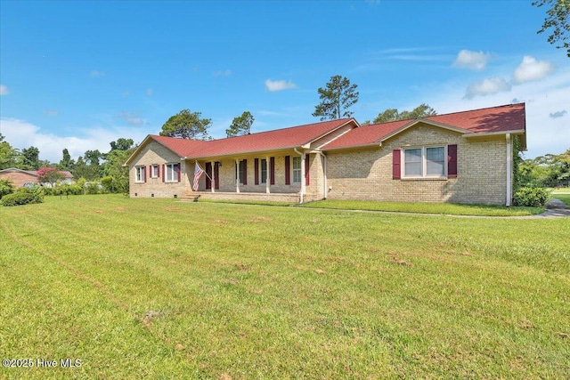 198 Verona Rd, Jacksonville, NC 28540 - ranch-style home with covered porch, a front yard, and brick siding