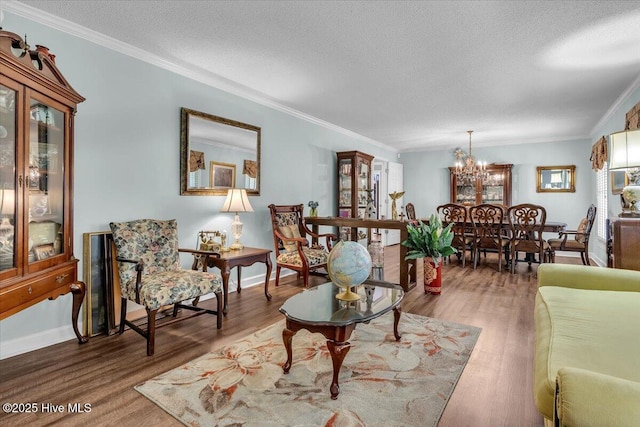 198 Verona Rd, Jacksonville, NC 28540 - living area with a chandelier, a textured ceiling, wood finished floors, and ornamental molding