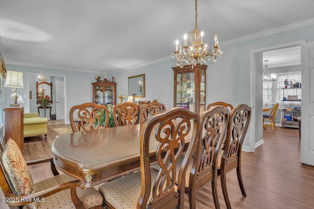 198 Verona Rd, Jacksonville, NC 28540 - dining area featuring a chandelier, wood finished floors, and ornamental molding