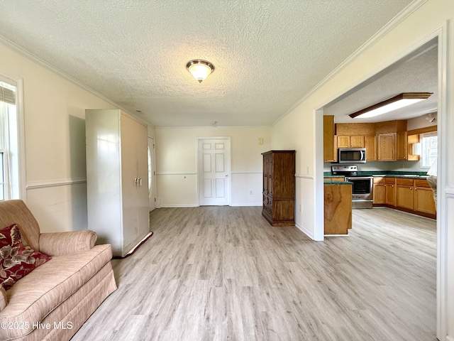 226 Community Rd, Lillington, NC 27546 - living area featuring a textured ceiling, light wood-style floors, and ornamental molding