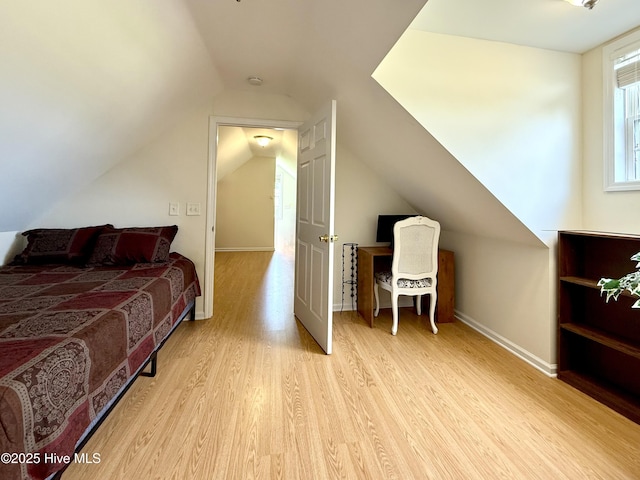 226 Community Rd, Lillington, NC 27546 - bedroom with wood finished floors and vaulted ceiling