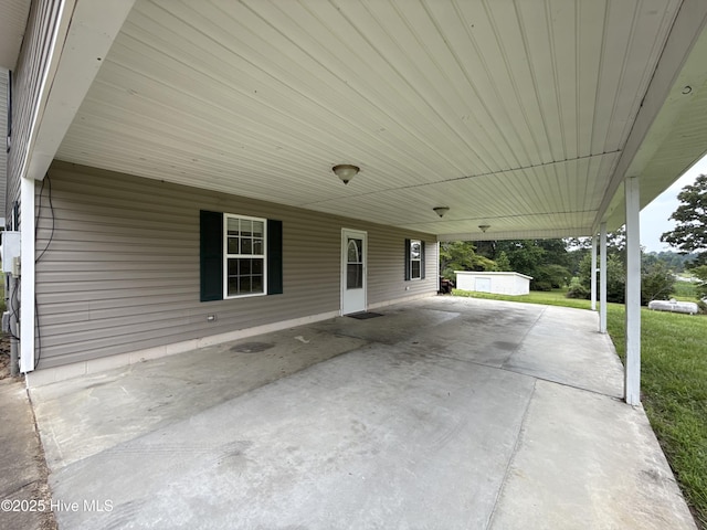 226 Community Rd, Lillington, NC 27546 - view of patio / terrace featuring an attached carport and an outbuilding
