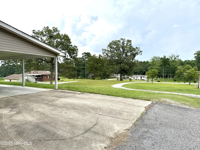 226 Community Rd, Lillington, NC 27546 - view of green lawn with view of wooded area