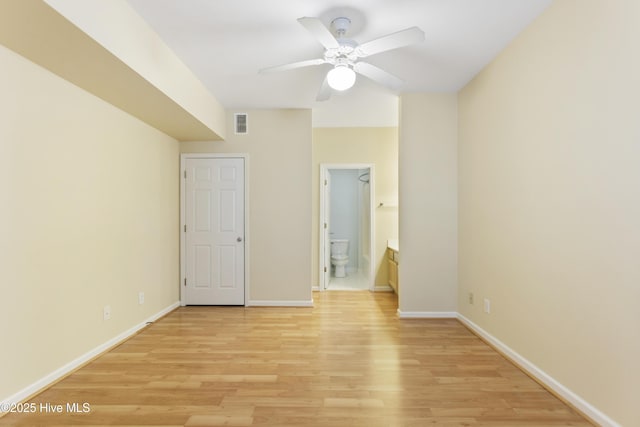 215 Royal Poste Rd Unit 2709, Sunset Beach, NC 28468 - unfurnished bedroom featuring light wood-type flooring, ensuite bath, and a ceiling fan