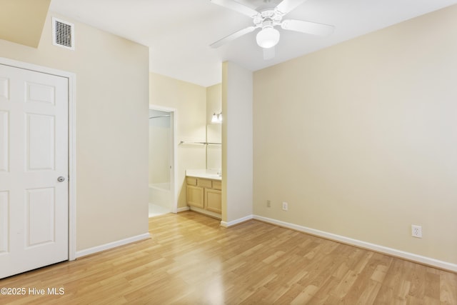215 Royal Poste Rd Unit 2709, Sunset Beach, NC 28468 - unfurnished bedroom featuring light wood-style floors, ensuite bath, and ceiling fan