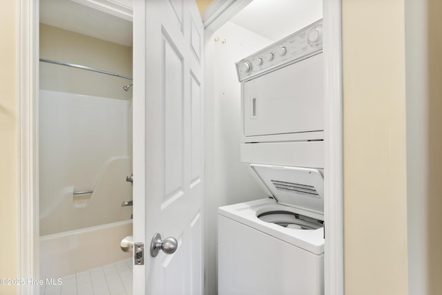 215 Royal Poste Rd Unit 2709, Sunset Beach, NC 28468 - laundry area with stacked washing machine and dryer and tile patterned floors