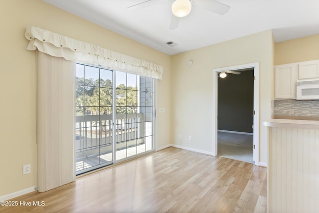 215 Royal Poste Rd Unit 2709, Sunset Beach, NC 28468 - unfurnished dining area featuring ceiling fan and light wood-style flooring