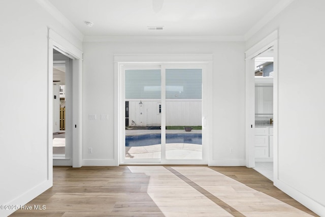 1320 Searay Ln, Carolina Beach, NC 28428 - hallway featuring wood finished floors and crown molding