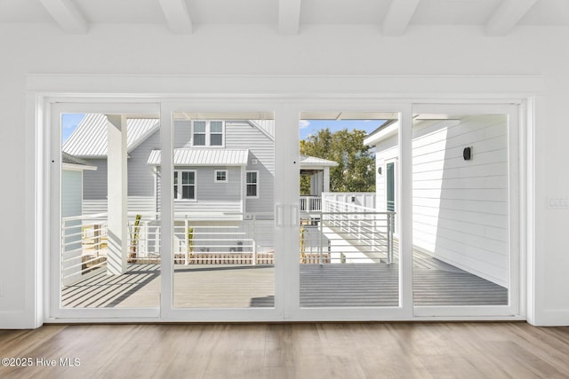 1320 Searay Ln, Carolina Beach, NC 28428 - doorway to outside with beamed ceiling, healthy amount of natural light, and wood finished floors