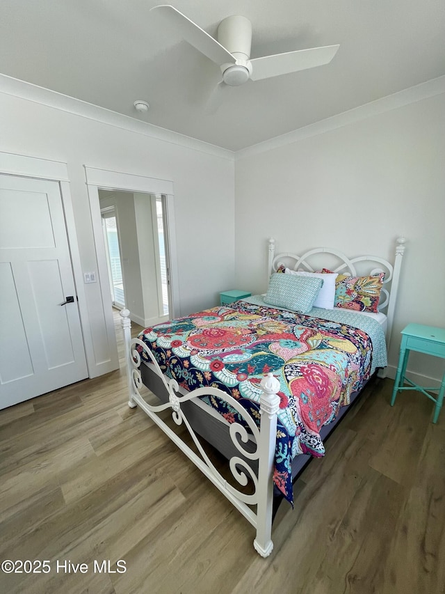 1320 Searay Ln, Carolina Beach, NC 28428 - bedroom featuring ornamental molding, wood finished floors, and ceiling fan