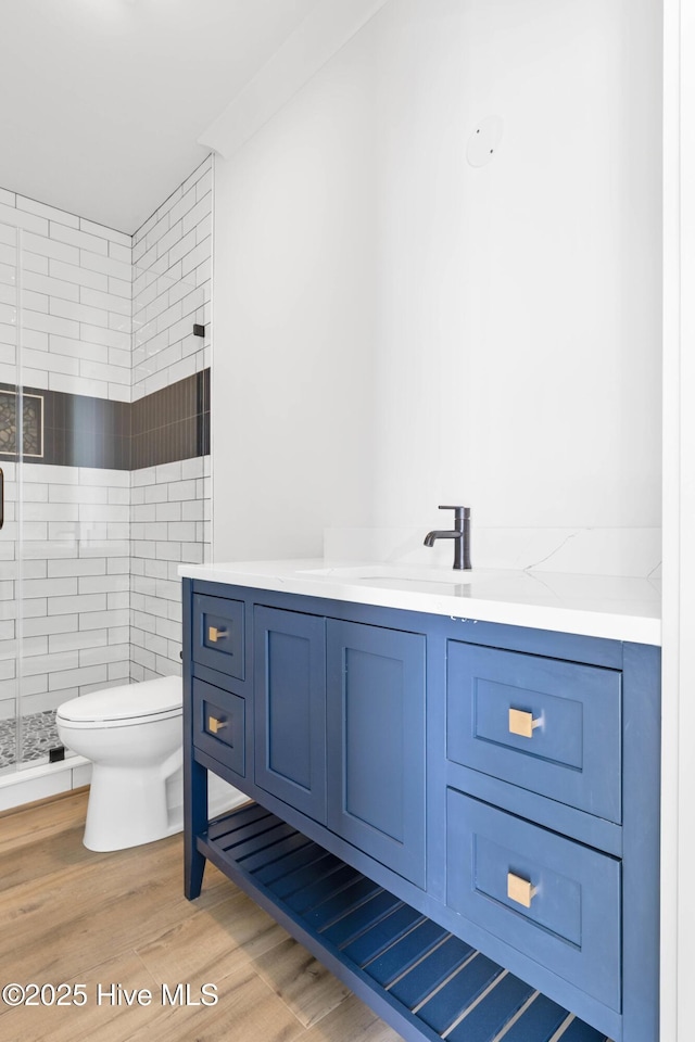1320 Searay Ln, Carolina Beach, NC 28428 - full bathroom with a shower stall, vanity, and wood finished floors