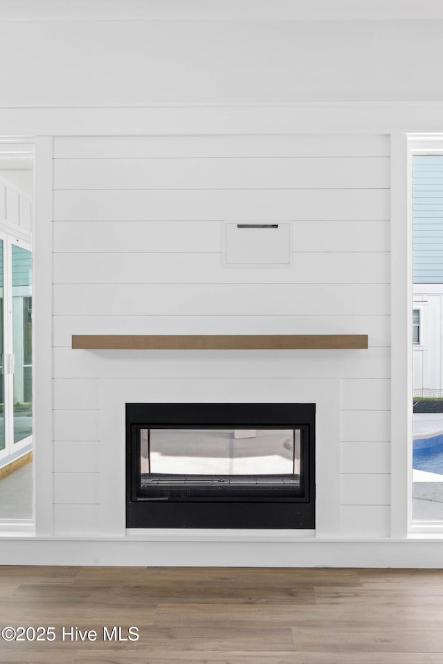 1320 Searay Ln, Carolina Beach, NC 28428 - detailed view of a glass covered fireplace and wood finished floors