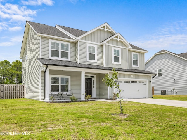 510 Transom Way, Sneads Ferry, NC 28460 - view of front facade with concrete driveway, board and batten siding, a porch, a garage, and roof with shingles