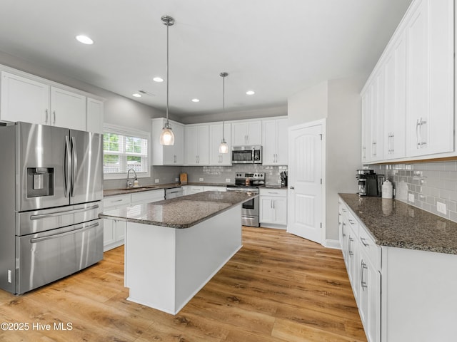 510 Transom Way, Sneads Ferry, NC 28460 - kitchen with stainless steel appliances, decorative backsplash, white cabinetry, and recessed lighting