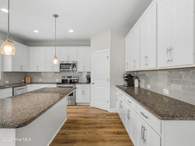 510 Transom Way, Sneads Ferry, NC 28460 - kitchen featuring stainless steel appliances, tasteful backsplash, white cabinetry, wood finished floors, and recessed lighting