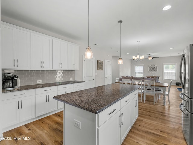 510 Transom Way, Sneads Ferry, NC 28460 - kitchen featuring freestanding refrigerator, light wood-style floors, white cabinetry, decorative backsplash, and recessed lighting