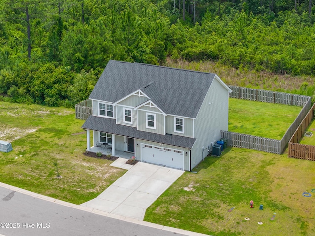 510 Transom Way, Sneads Ferry, NC 28460 - view of front facade featuring a shingled roof, a porch, an attached garage, driveway, and a fenced backyard