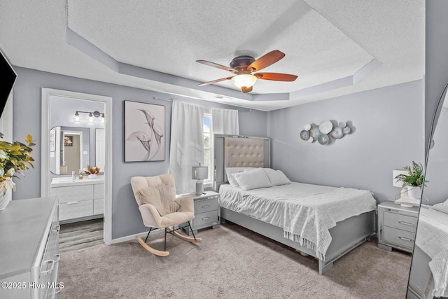 105 Marina Leigh Dr, Hubert, NC 28539 - carpeted bedroom with a raised ceiling, a textured ceiling, ensuite bathroom, and ceiling fan