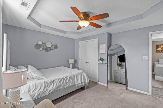 105 Marina Leigh Dr, Hubert, NC 28539 - carpeted bedroom with a raised ceiling, ceiling fan, a textured ceiling, and a closet