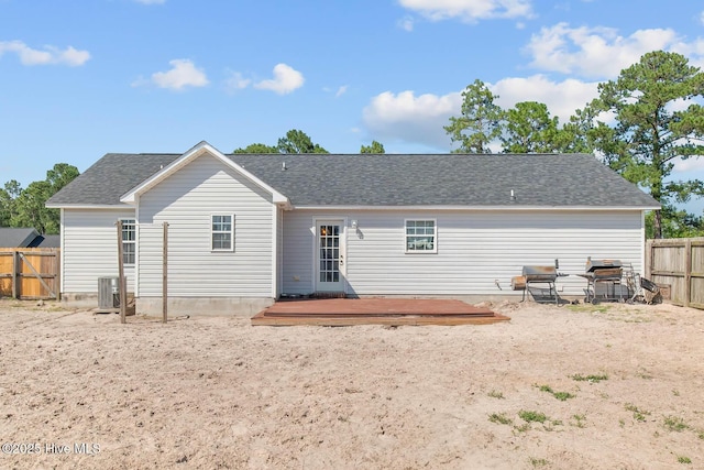105 Marina Leigh Dr, Hubert, NC 28539 - rear view of property featuring a fenced backyard, a deck, and a shingled roof