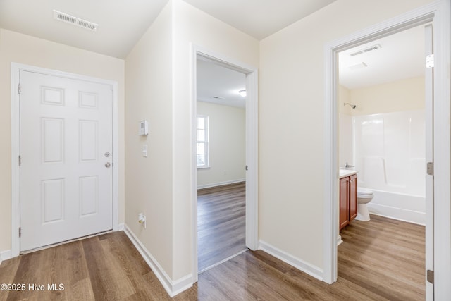3021 Evening Rd, Castle Hayne, NC 28429 - hall featuring wood finished floors and baseboards