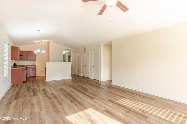 3021 Evening Rd, Castle Hayne, NC 28429 - unfurnished living room featuring lofted ceiling, light wood finished floors, a chandelier, and ceiling fan