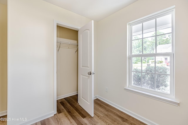 3021 Evening Rd, Castle Hayne, NC 28429 - unfurnished bedroom featuring wood finished floors and a closet