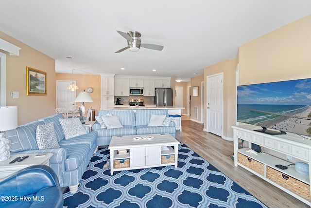 811 Colony Pl # D, Sunset Beach, NC 28468 - living room featuring ceiling fan, light wood finished floors, and recessed lighting