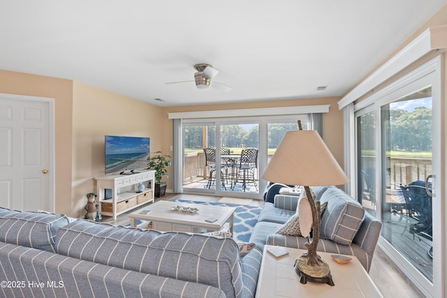 811 Colony Pl # D, Sunset Beach, NC 28468 - living area featuring healthy amount of natural light, a ceiling fan, and wood finished floors