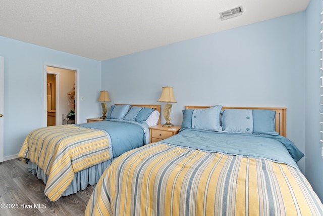 811 Colony Pl # D, Sunset Beach, NC 28468 - bedroom featuring wood finished floors and baseboards