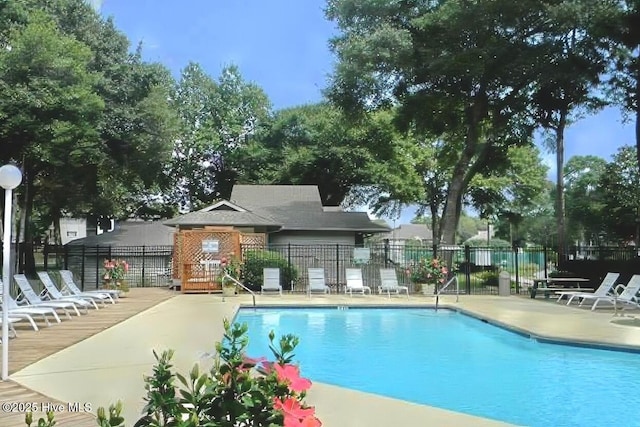 811 Colony Pl # D, Sunset Beach, NC 28468 - community pool featuring a wooden deck