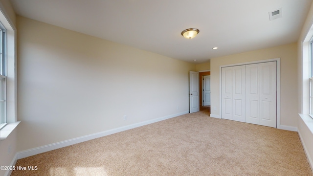341 Oleander Dr, Greenville, NC 27858 - unfurnished bedroom featuring carpet flooring, a closet, and recessed lighting