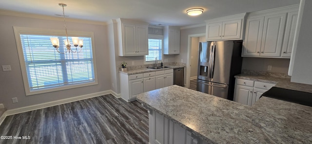 196 Asheberne Dr, Washington, NC 27889 - kitchen featuring appliances with stainless steel finishes, white cabinetry, a chandelier, and crown molding